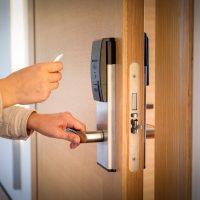 Opening a hotel door with keyless entry card.