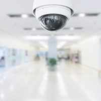 CCTV Security Camera operating in hospital on blur background.